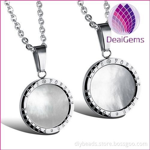 round stainless steel couple pendant with white shell